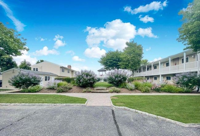 View of community featuring a lawn | Image 10