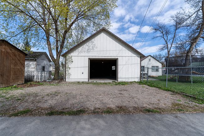 Detached garage featuring fence | Image 34