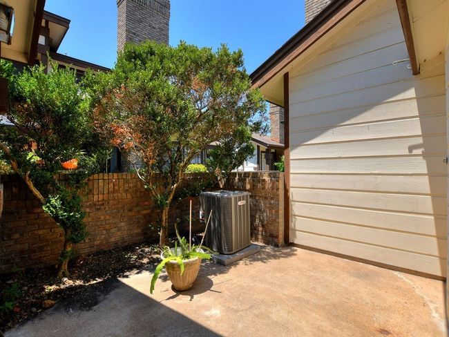 View of patio / terrace featuring fence and cooling unit | Image 13