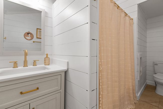Bathroom featuring vanity and a shower with shower curtain | Image 33