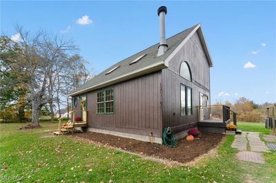 View of property exterior featuring side deck. | Image 2