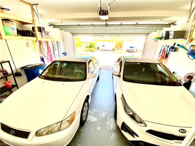 Garage with a garage door opener | Image 17