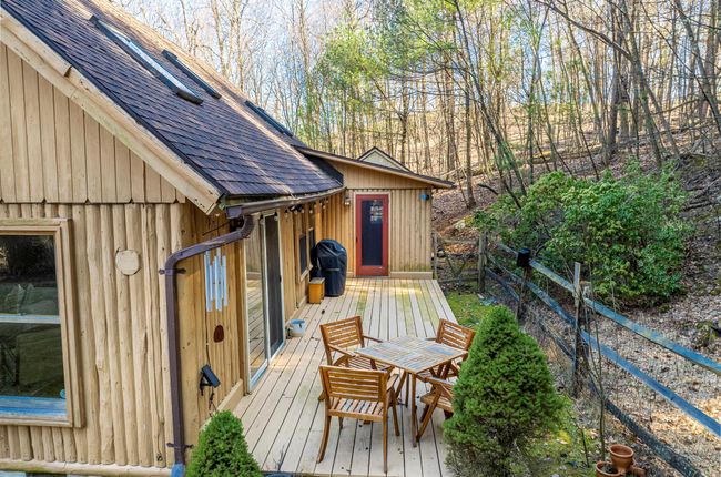 Deck with outdoor dining area and fence | Image 7