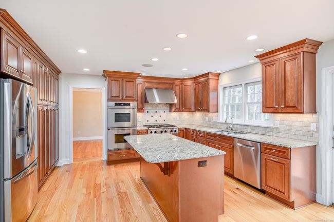 Double wall ovens and 6-burner gas cooktop. | Image 11