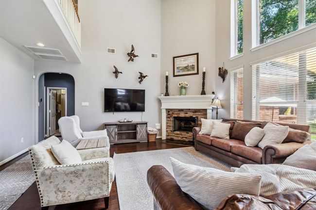 Family room with gas log fireplace. | Image 8