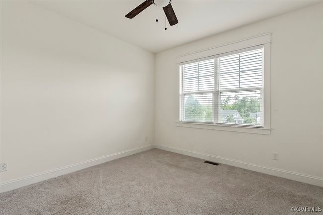 Spare room with light colored carpet and a ceiling fan | Image 19