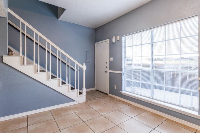 Foyer featuring stairway and tile patterned floors | Image 4