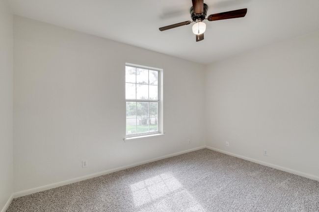 Unfurnished room featuring carpet flooring and ceiling fan | Image 20