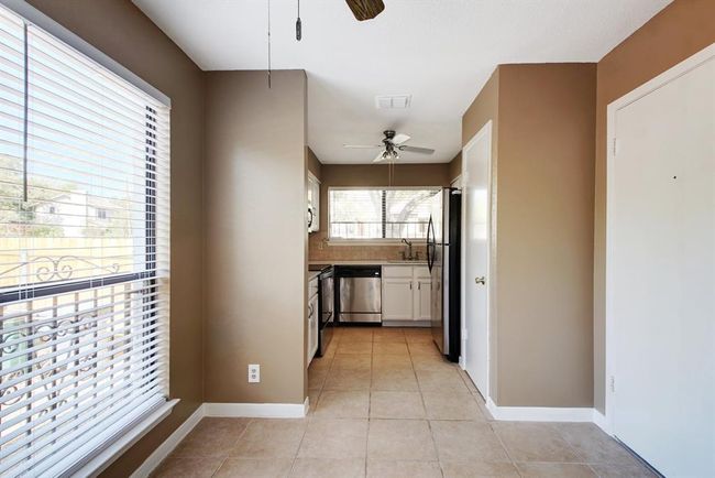 Another view of the dining looking into the kitchen | Image 13