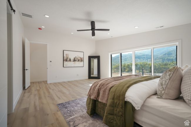 Bedroom with light wood finished floors, recessed lighting, baseboards, ceiling fan, and access to exterior | Image 8