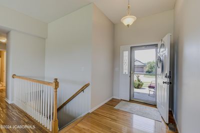 The storm door which was added to the primary entrance adds an abundance of natural light to the living area. | Image 3