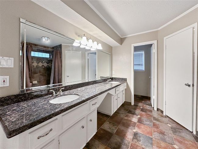 Primary restroom has plenty of storage- includes two walk-in closets! | Image 8