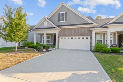 Charming curb appeal with paver boarders around the landscape beds. | Image 2