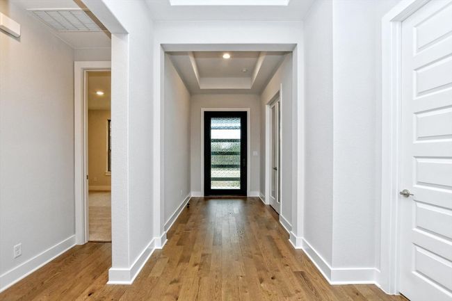 Doorway with wood finished floors | Image 6