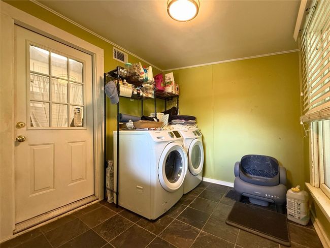 Washroom featuring separate washer and dryer and ornamental molding | Image 9