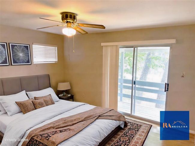 Charming upstairs bedroom with private ensuite bath. (virtually staged) | Image 13