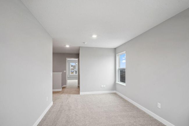 The upper level loft is a great space to unwind, read books or watch TV. Model photos. Options and colors will vary. | Image 27