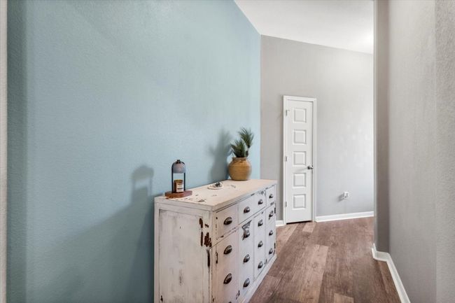 Hall with wood finished floors and baseboards | Image 7