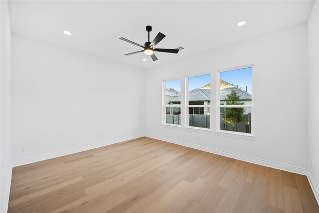 Empty room featuring light wood-type flooring, ceiling fan, and recessed lighting | Image 31