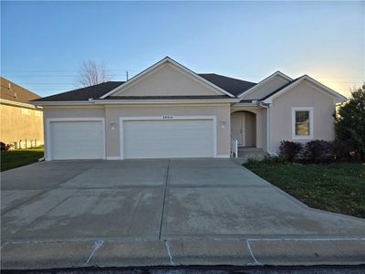 Ranch-style home with a garage | Image 1