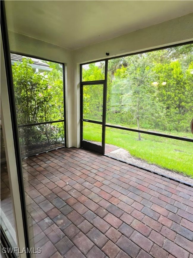 View of unfurnished sunroom | Image 18