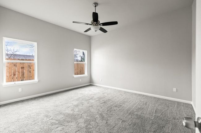 Unfurnished room featuring ceiling fan and carpet floors | Image 13