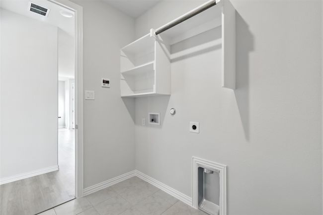 Washroom featuring hookup for a gas dryer, washer hookup, and electric dryer hookup | Image 26