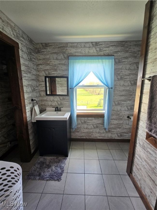 Bathroom with vanity and tile patterned floors | Image 18