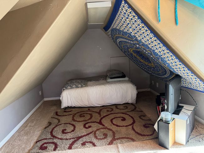 Carpeted bedroom with vaulted ceiling and baseboards | Image 28