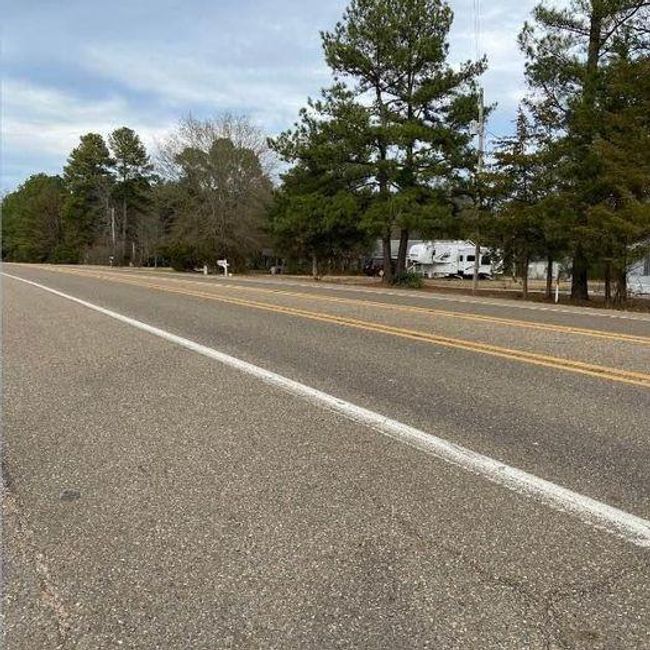 view from across the street of property. RV hook up on property | Image 14