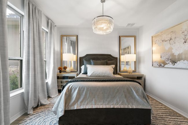 Currently being used as an extra bedroom, this flex space/home office includes a gorgeous light fixture and can be utilized however your heart desires. | Image 6