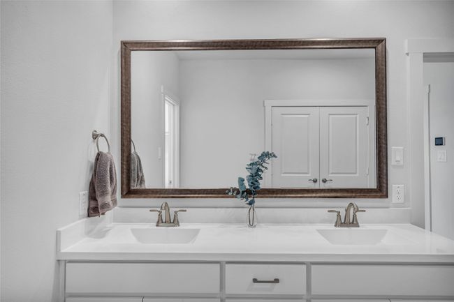 Bright and spacious primary bath suite with dual sink vanity, shower, and private water closet. | Image 20