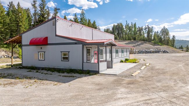 View of front of home featuring metal roof | Image 105
