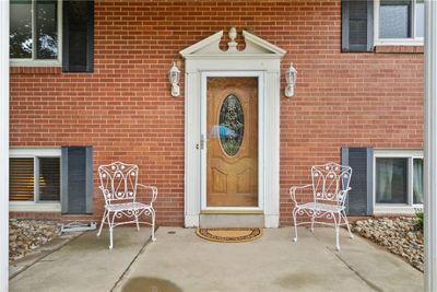 Covered front patio welcomes your guests. | Image 3