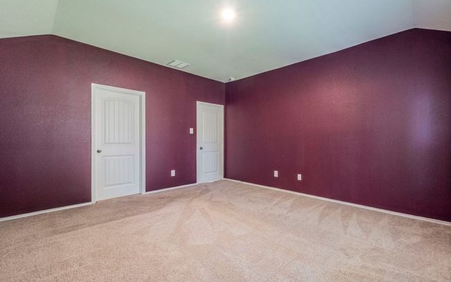 Spare room with lofted ceiling and carpet floors | Image 10