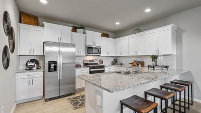 Kitchen - All Home and community information, including pricing, included features, terms, availability and amenities, are subject to change at any time without notice or obligation. All Drawings, pictures, photographs, video, square footages, floor plans, elevations, features, colors and sizes are approximate for illustration purposes only and will vary from the homes as built. | Image 2