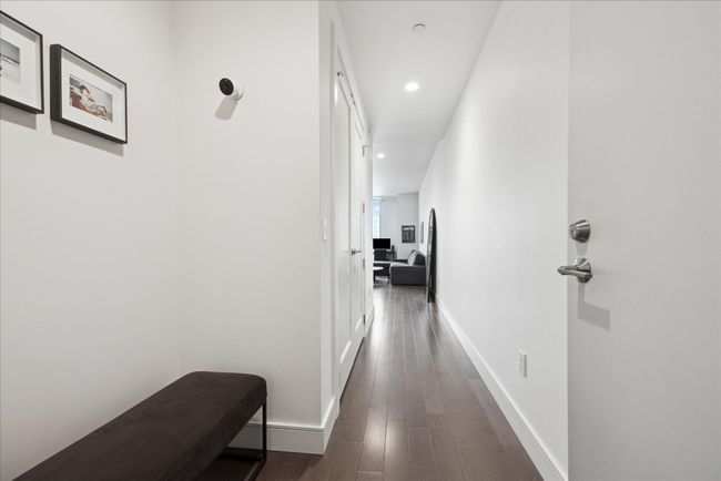 Inviting entry with room for storage, hall closet is finished out in California Closets. | Image 7