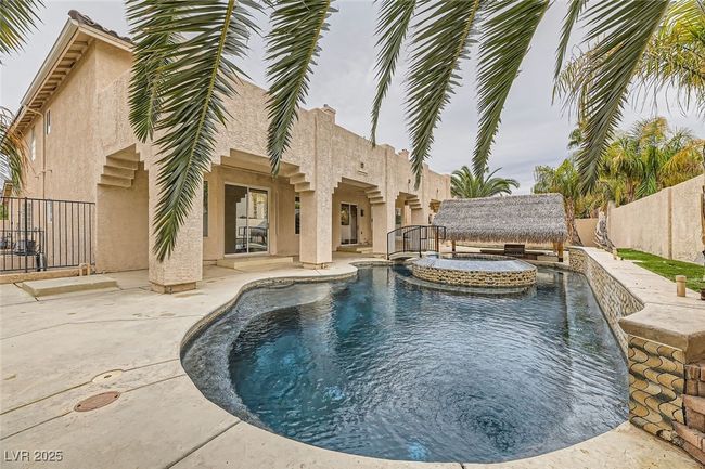 View of pool featuring a fenced backyard, a patio, and a pool with connected hot tub | Image 47