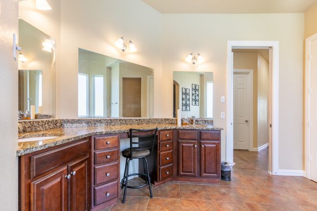 Bathroom featuring double vanity and baseboards | Image 18