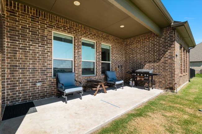 View of patio / terrace featuring area for grilling and fence | Image 33