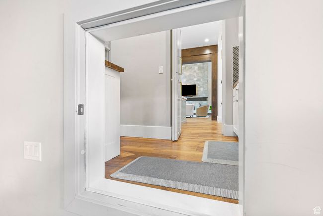 Corridor with baseboards and wood finished floors | Image 88