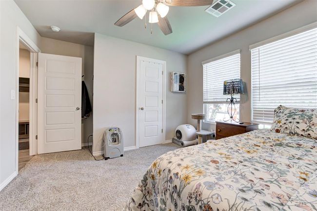Bedroom featuring carpet and ceiling fan | Image 36