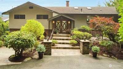 The grand entrance with steps to stunning double glass doors | Image 1