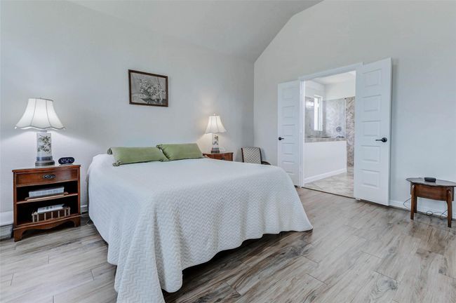 Ample space awaits for your large king-size bedroom set and more. Just beyond the elegant double doors, discover your private ensuite bathroom. | Image 15