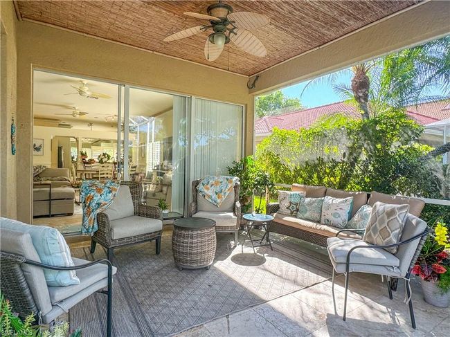 View of terrace featuring an outdoor hangout area and ceiling fan | Image 25