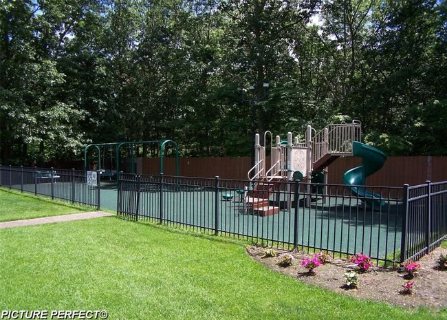 View of pool featuring a playground and a yard | Image 15