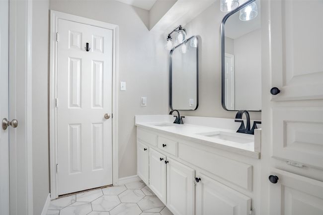 Bathroom featuring double vanity and baseboards | Image 28