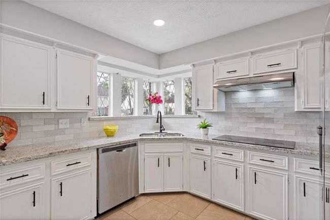 Kitchen features stainless steel appliances, granite counters and plenty of cabinets. | Image 21