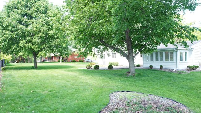 The partially fenced, large backyard is perfect for kids, dogs, and is ready for your personalizations. These may include a play structure, an in-ground pool, a deck or even a sport court. | Image 43