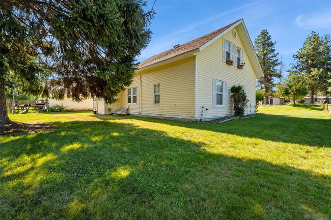 Rear view of property featuring a lawn | Image 10